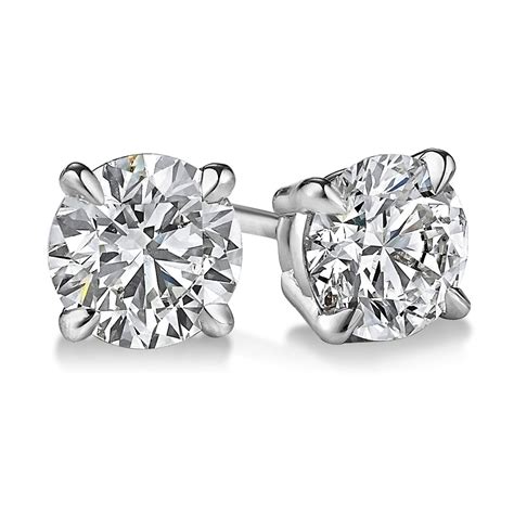 white diamond stud earrings.